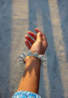 a person's arm with a bracelet on it