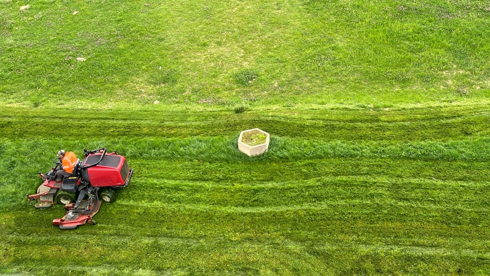 a tractor is parked in the middle of a green field