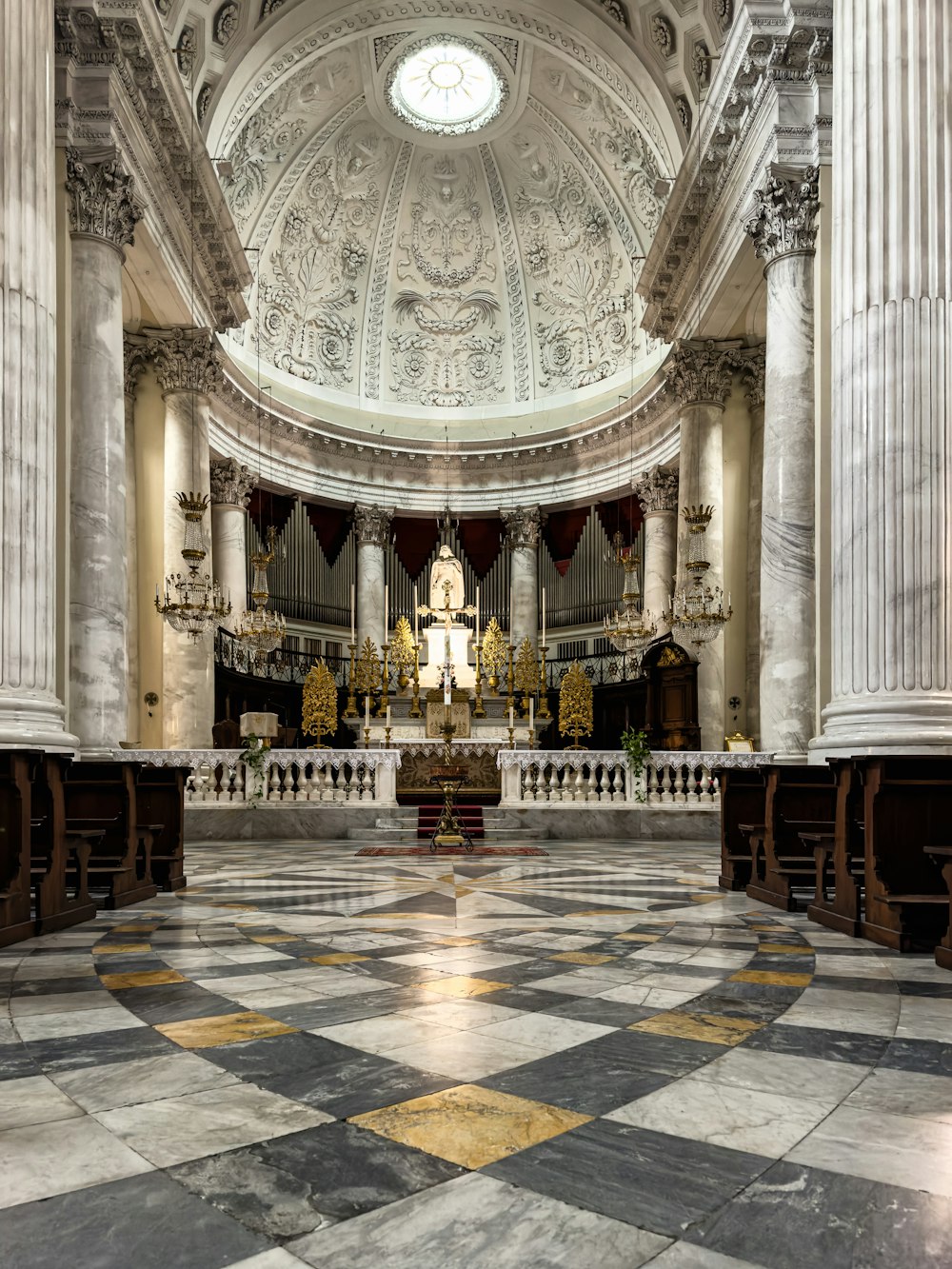 a large cathedral with a clock on the ceiling