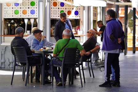 a group of people sitting around a table
