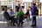 a group of people sitting around a table