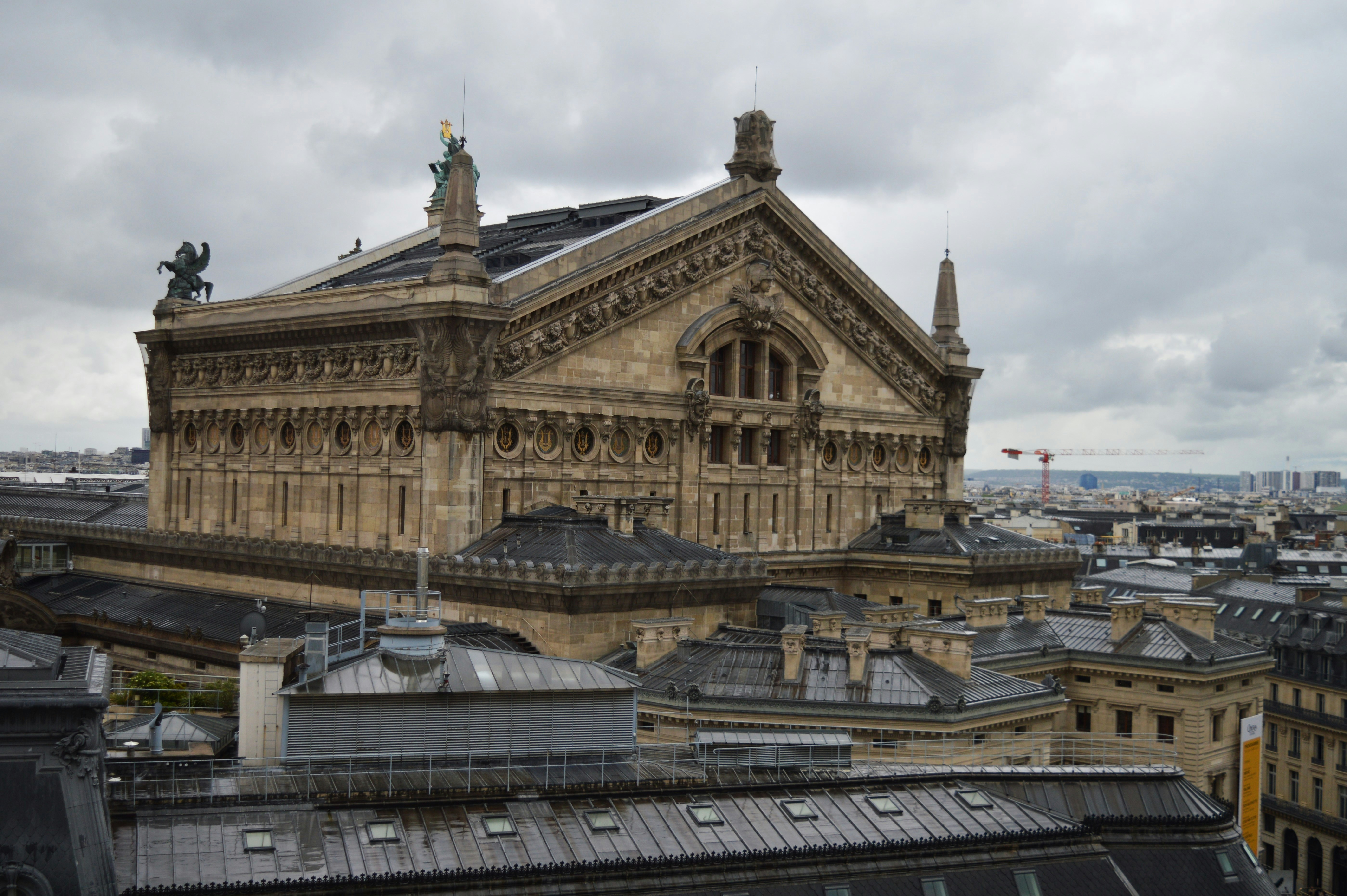 a view of a building with a statue on top of it
