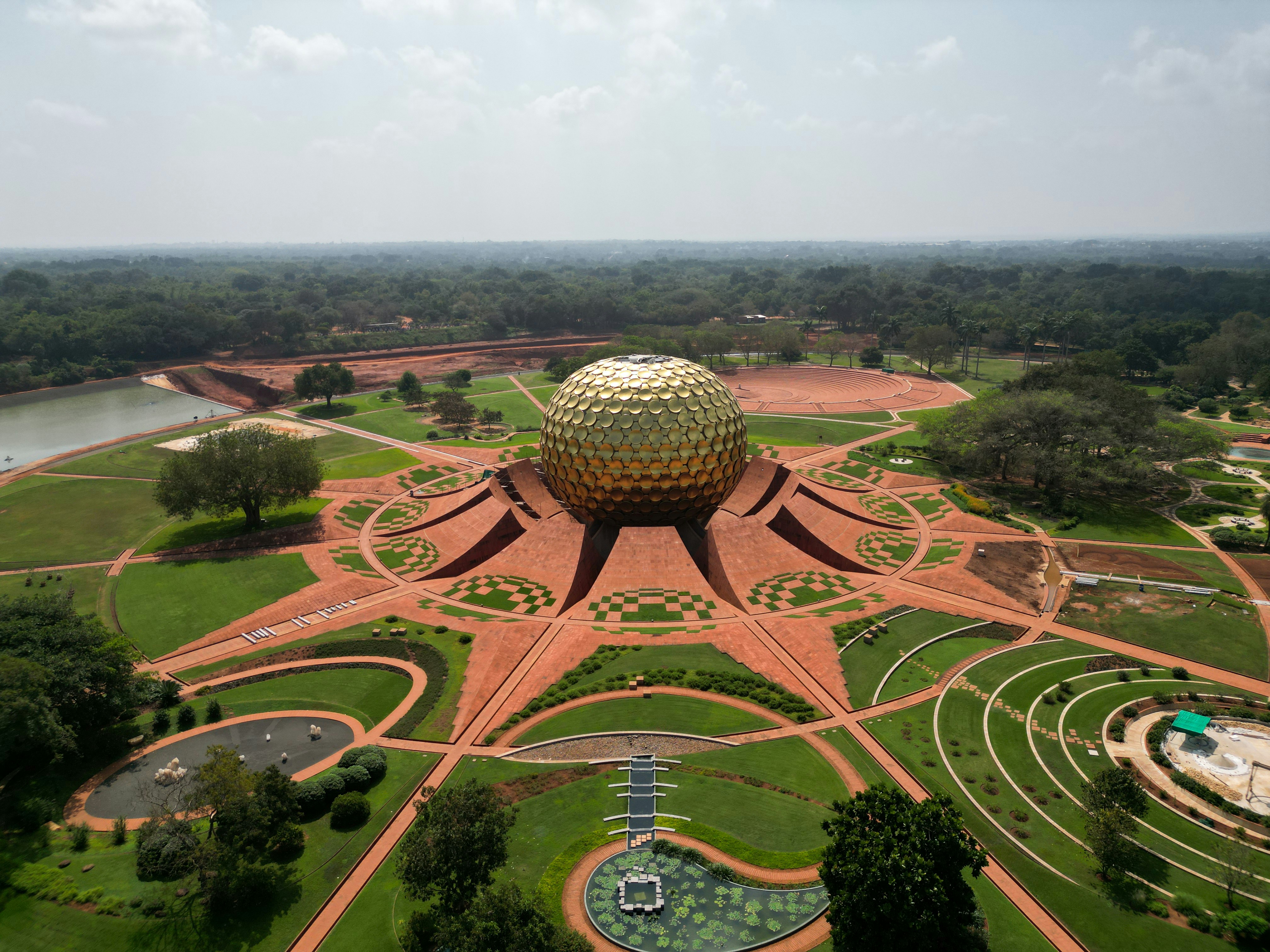 an aerial view of a park with a large ball in the center