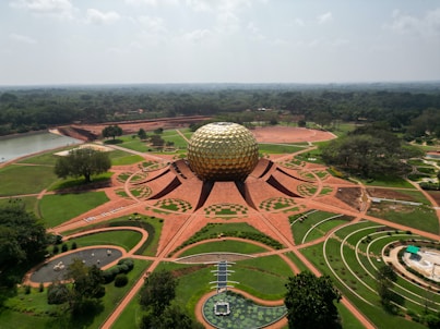 an aerial view of a park with a large ball in the center