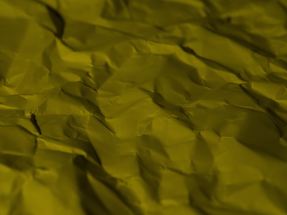 a close up of a piece of yellow paper