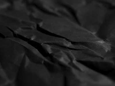 a close up of a black sheet of paper