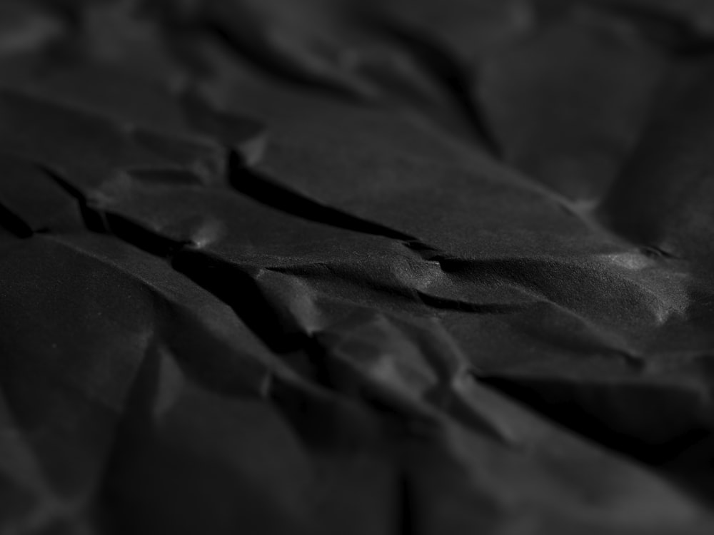 a close up of a black sheet of paper