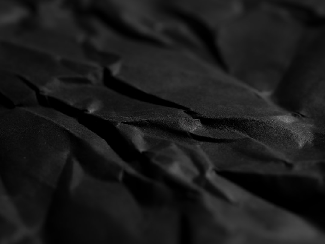 black wrinkled paper texture background
