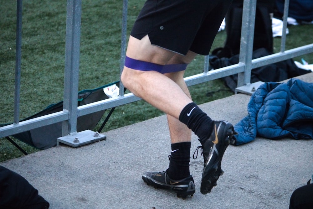 a man with a knee brace is running
