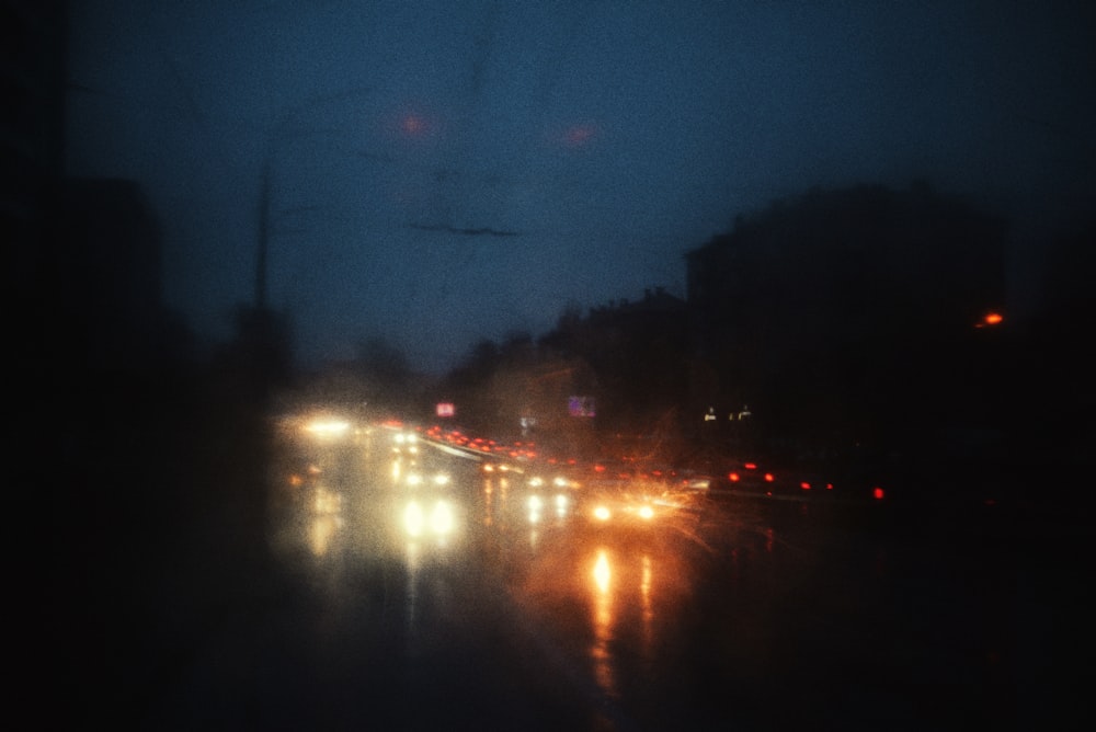 a blurry photo of a city street at night