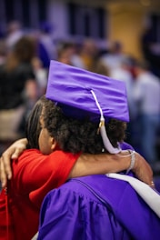 a couple of people that are hugging each other