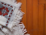 a close up of a piece of cloth on a wooden floor