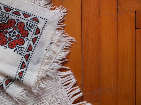a close up of a piece of cloth on a wooden floor
