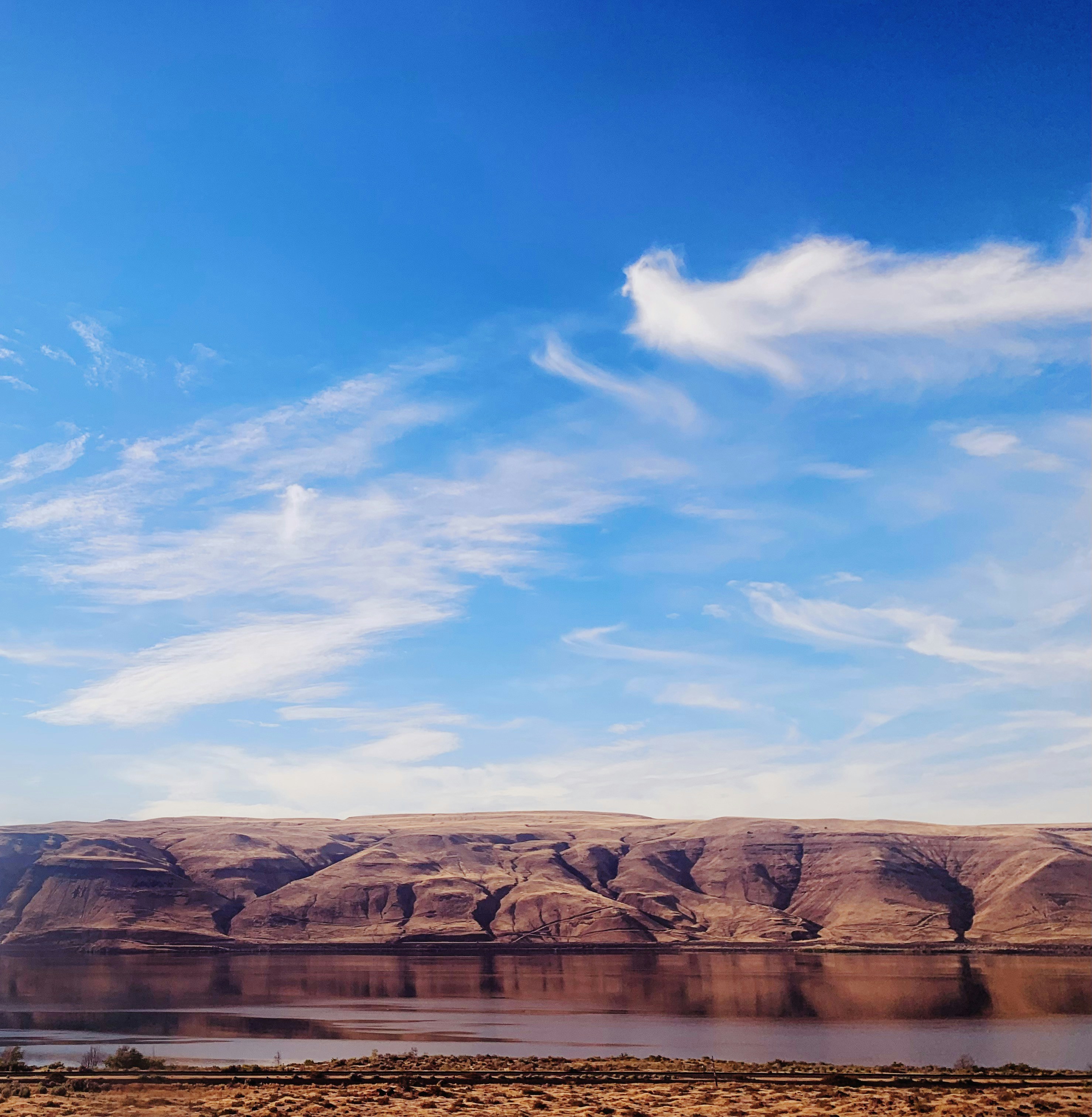 a large body of water sitting in the middle of a desert