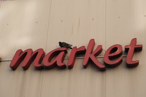 a sign that says market on the side of a building