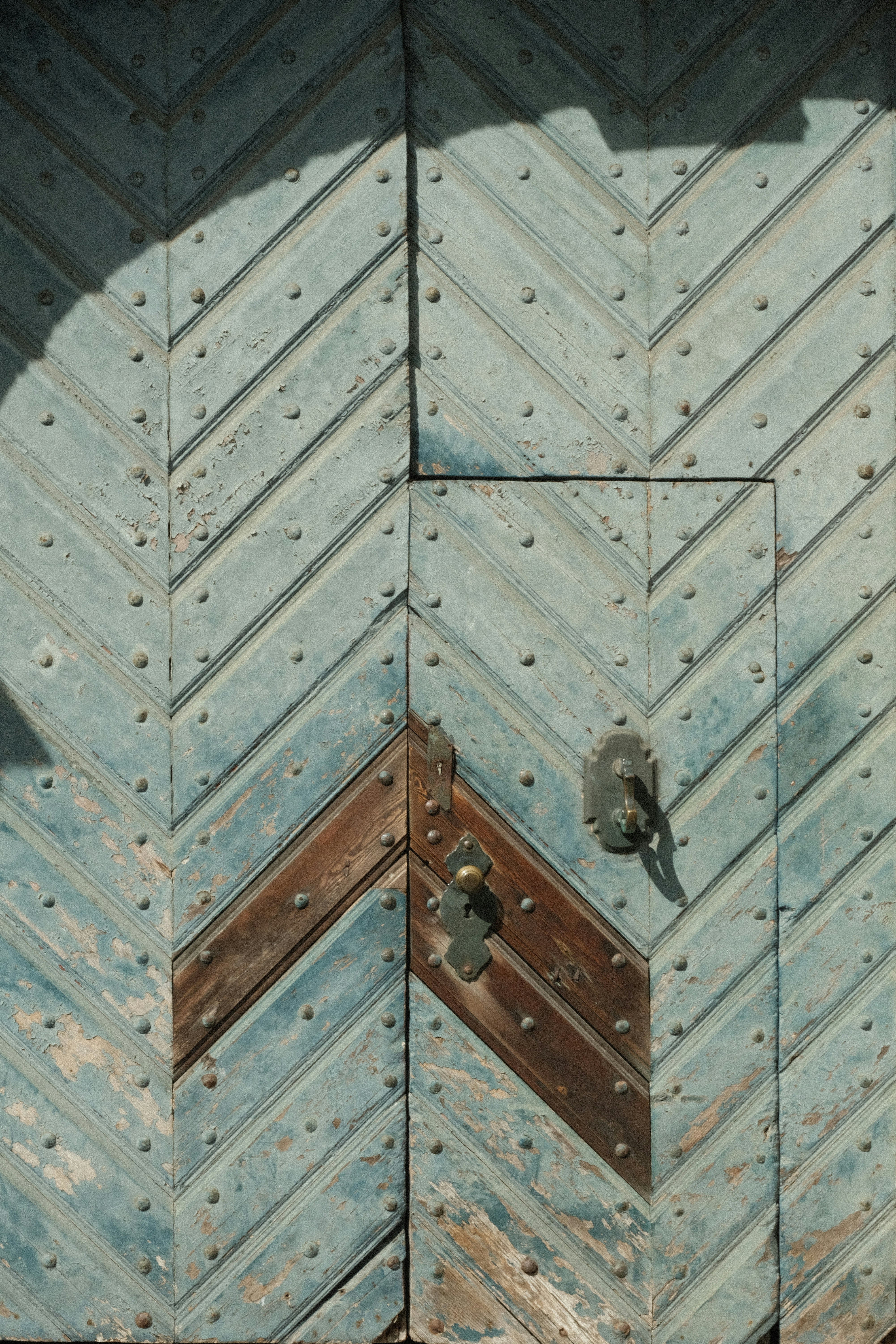 a close up of a metal door with a lock