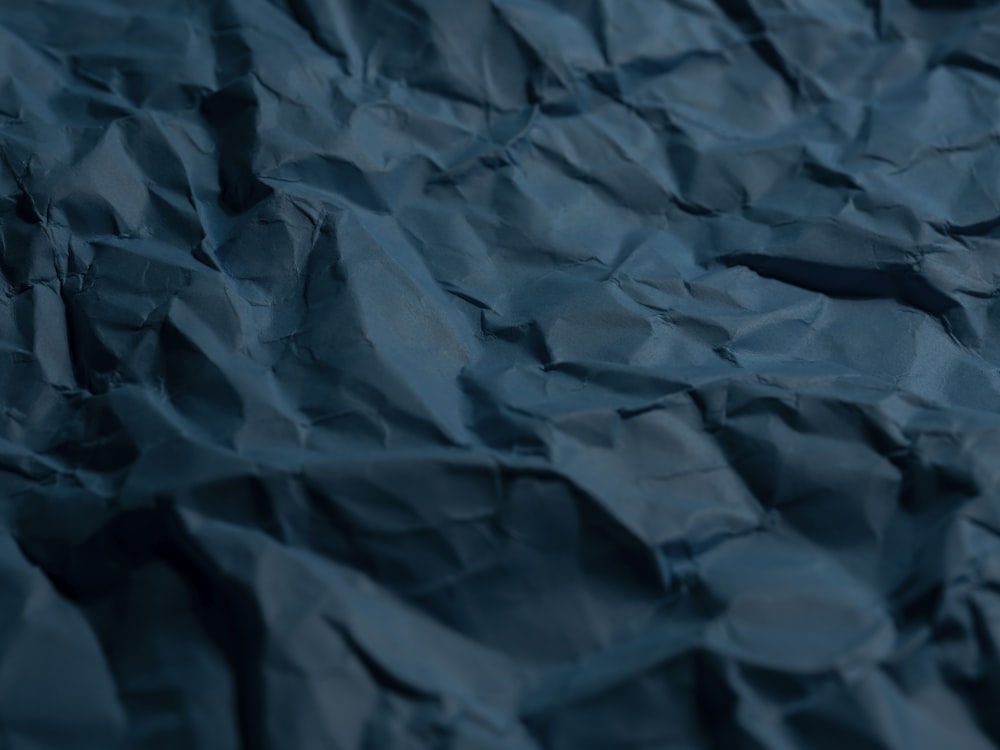 a close up of a blue crumpled paper