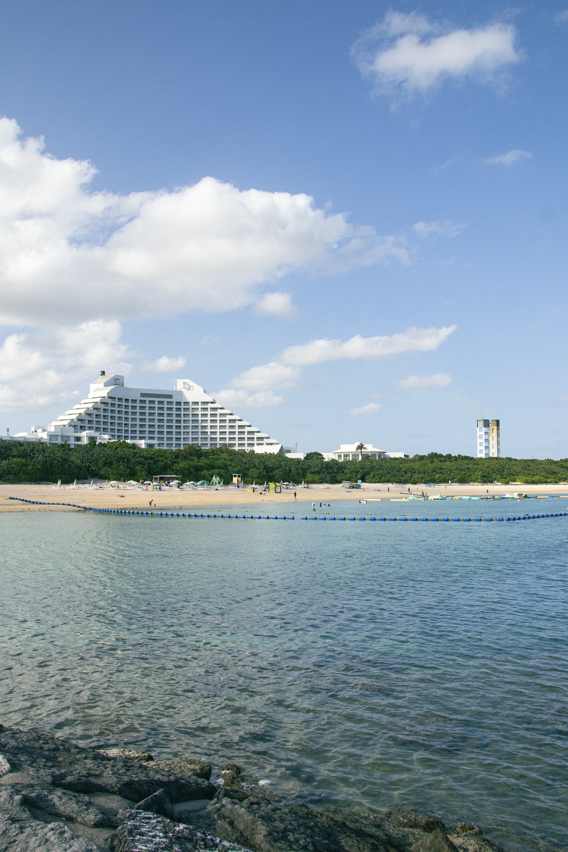 a body of water with a building in the background