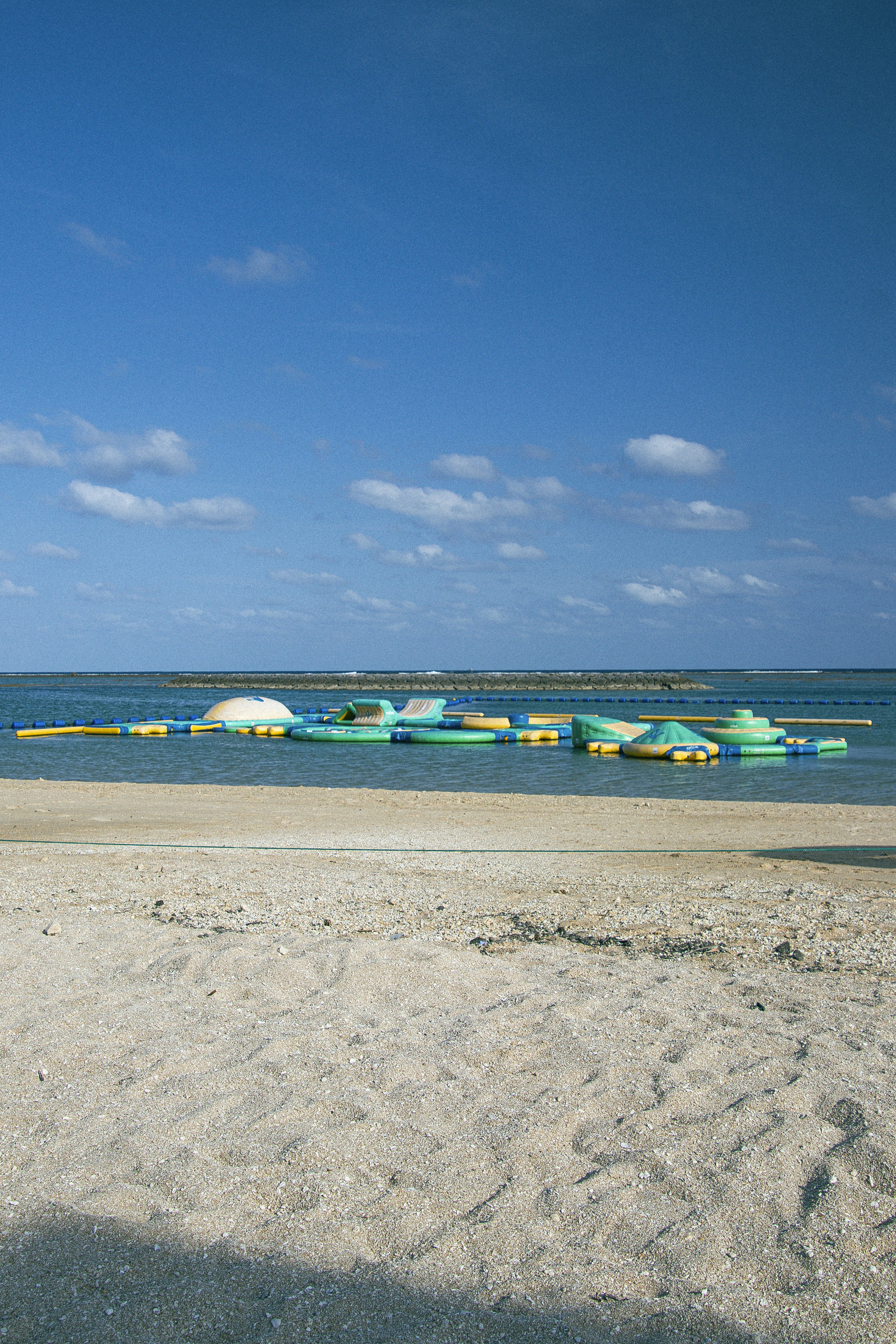 a group of boats floating on top of a body of water
