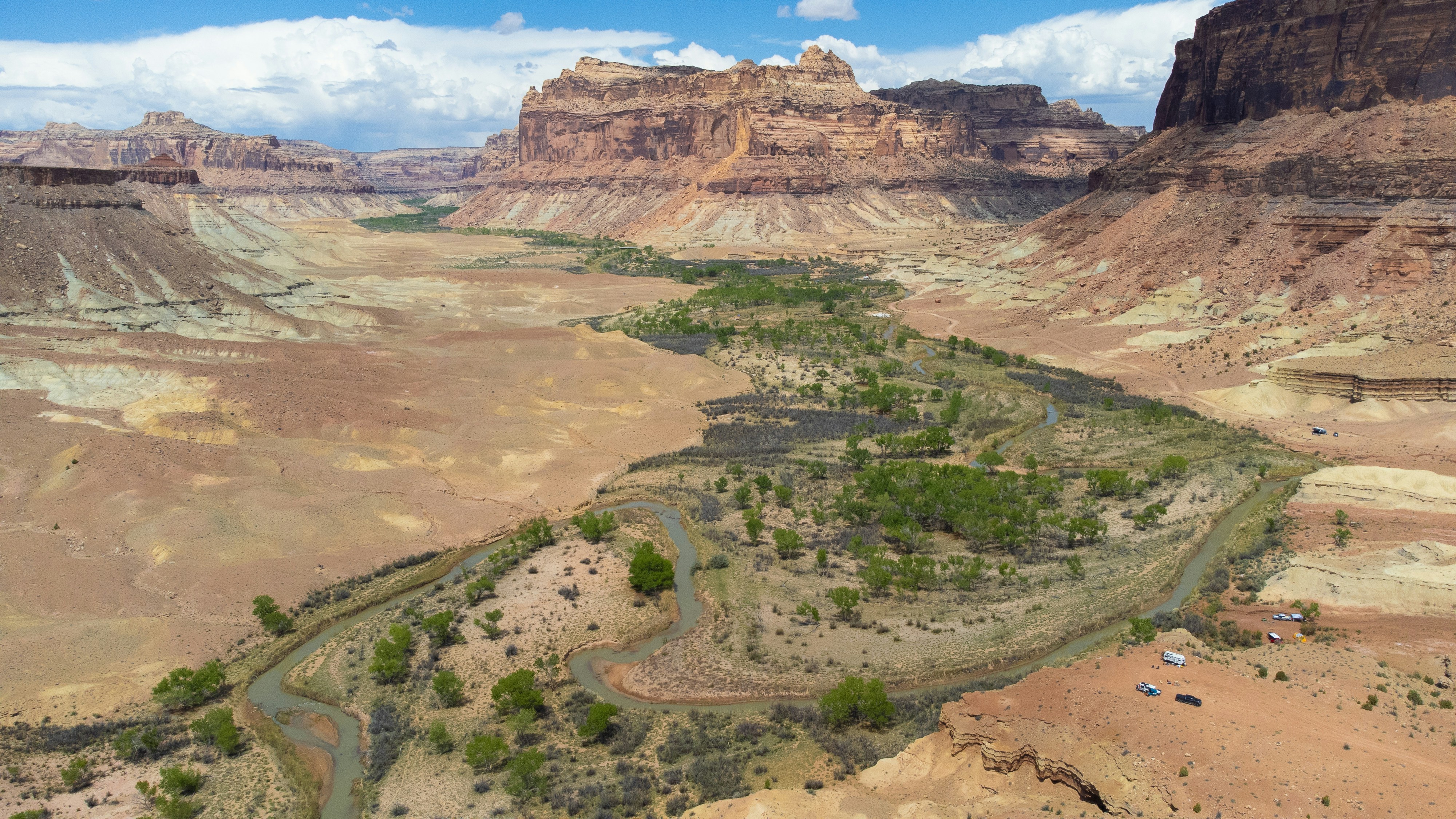 a river flowing through a canyon surrounded by mountains