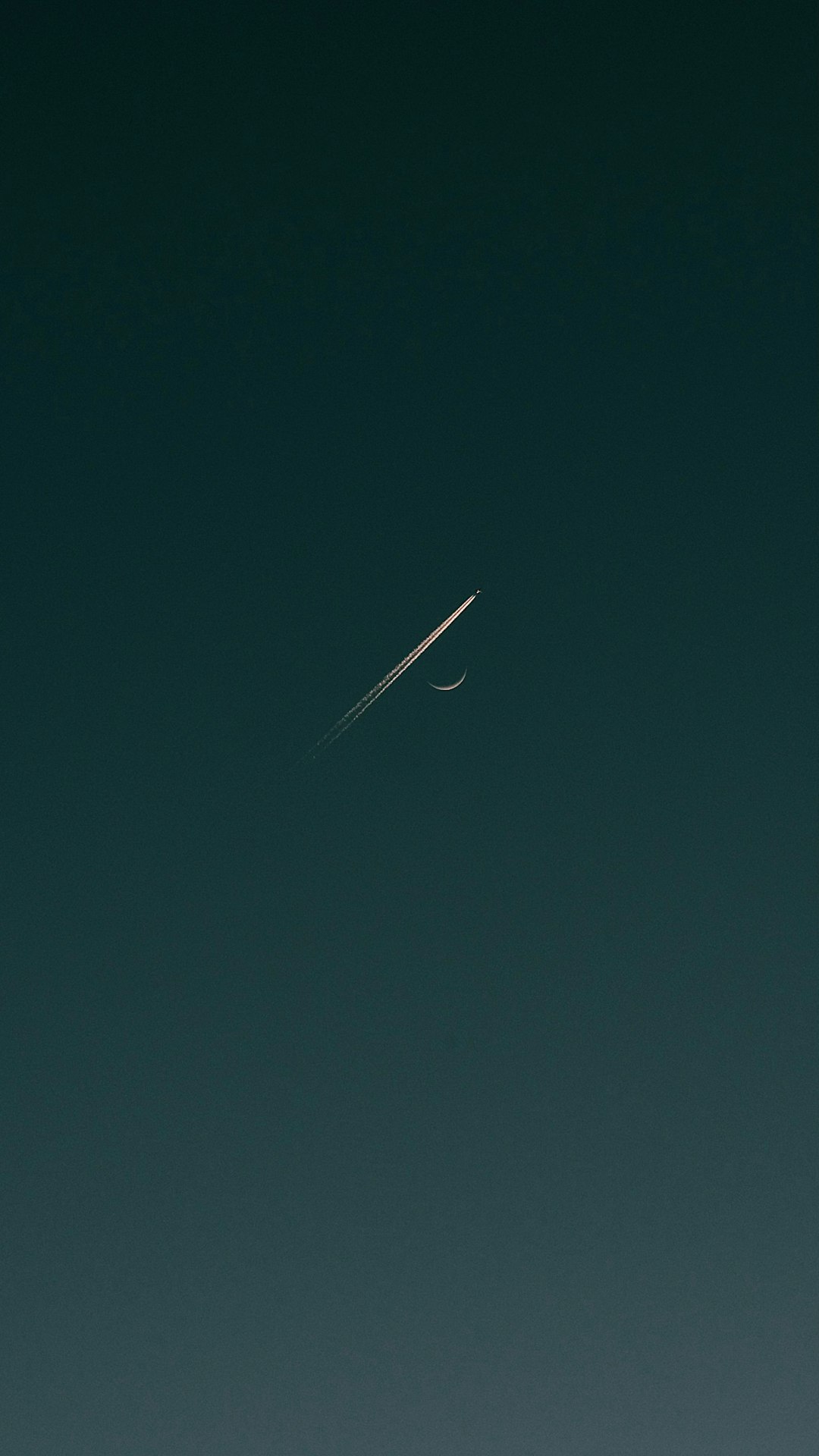 A plane passing by the moon