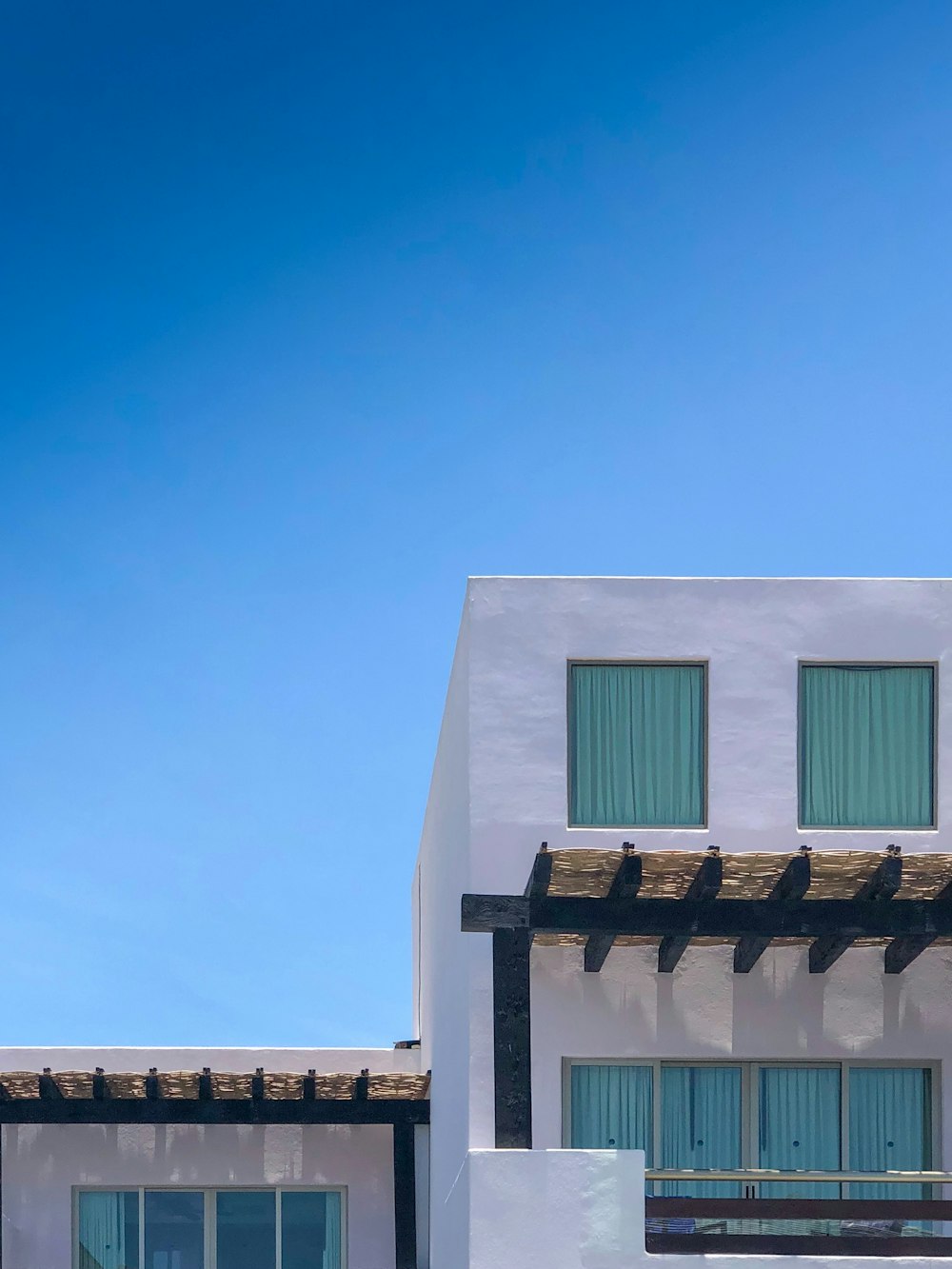 a white house with a blue sky in the background