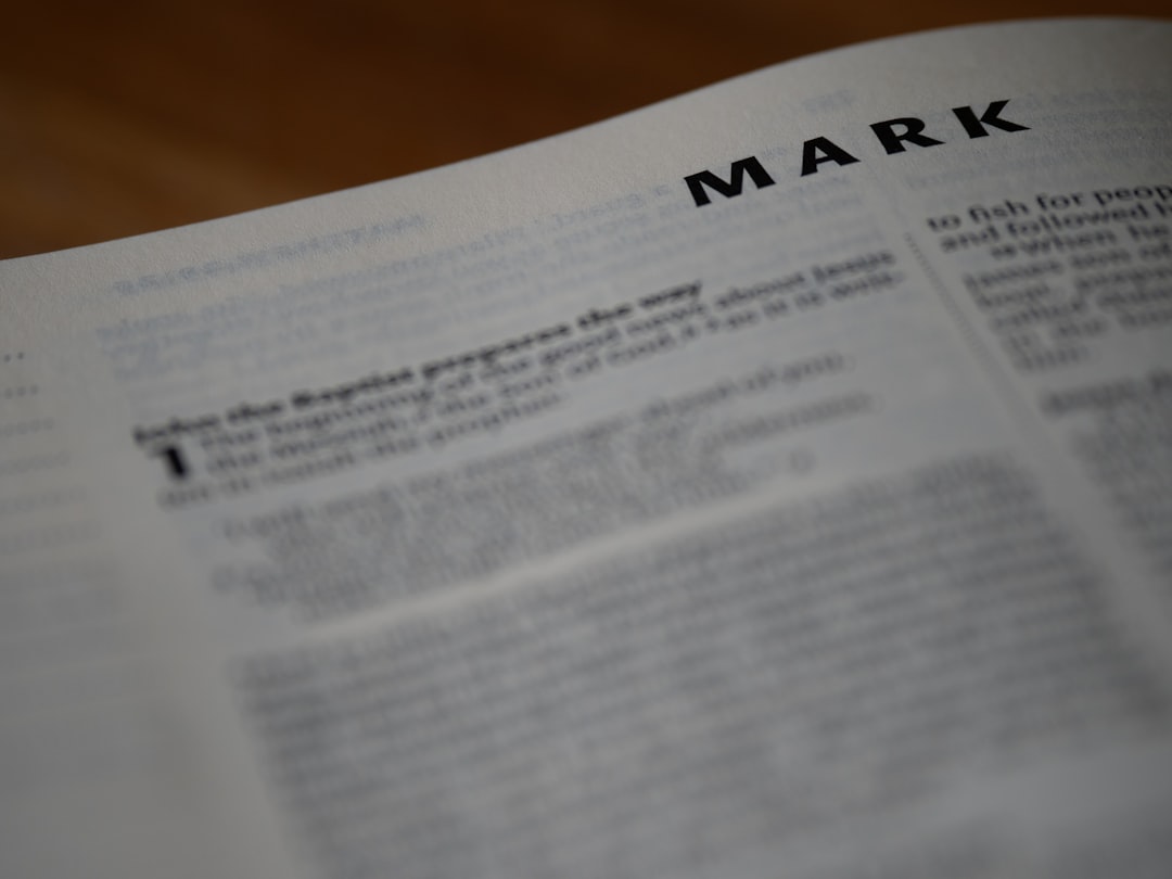 a close up of a book with a mark on it, close up, bokeh, bible, new testament, christian, history, text, reading, bible study, devotions, christianity, scripture, Gospel of Mark, Mark, Synoptic Gospel, Gospel,