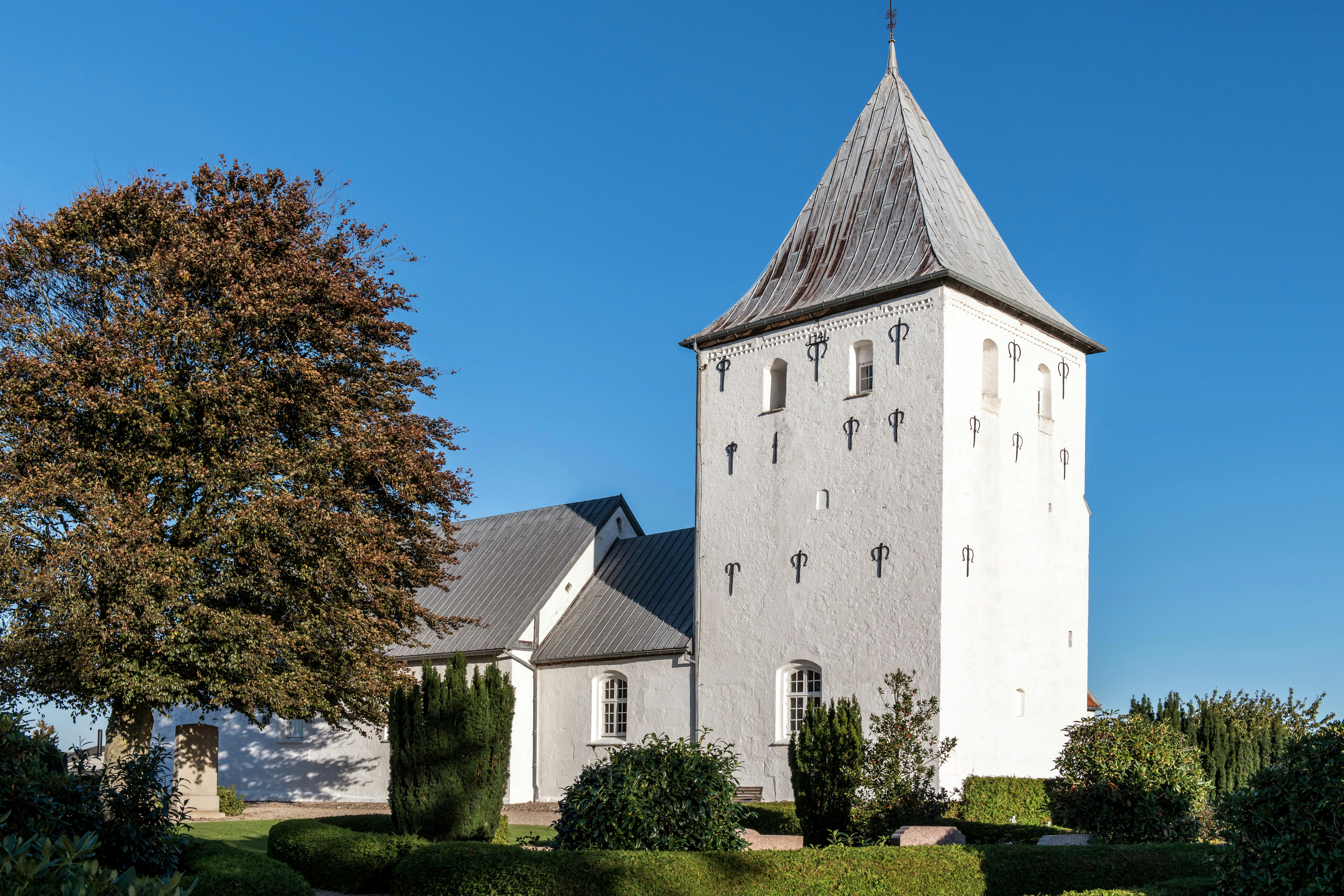 a large white building with a tall tower
