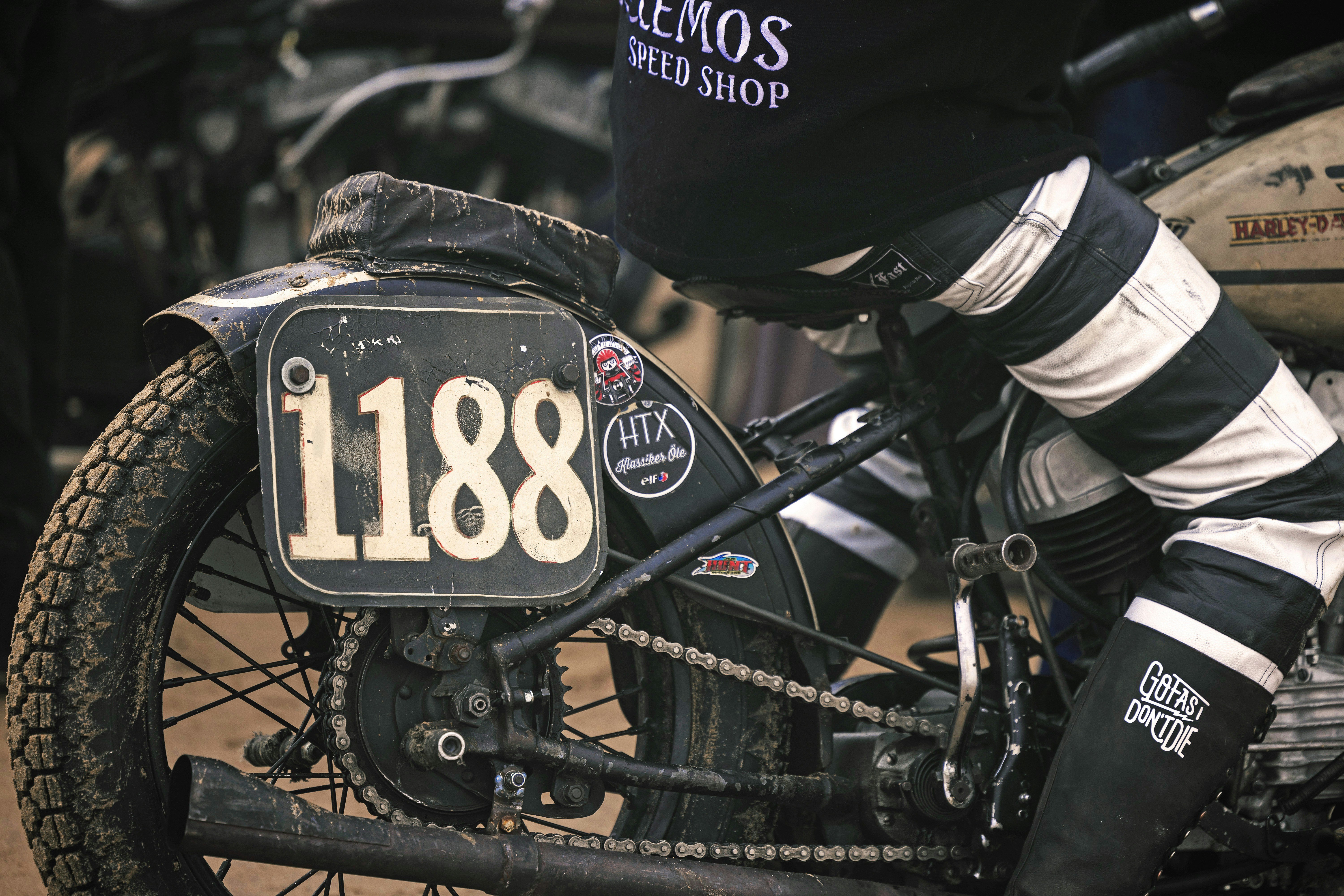 a close up of a motorcycle with a number plate