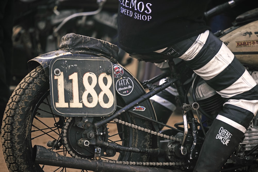 a close up of a motorcycle with a number plate