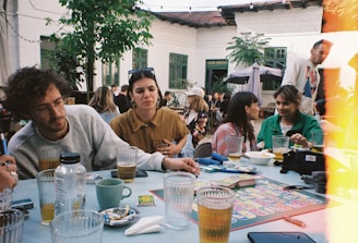 a group of people sitting around a table