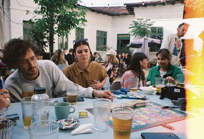 a group of people sitting around a table