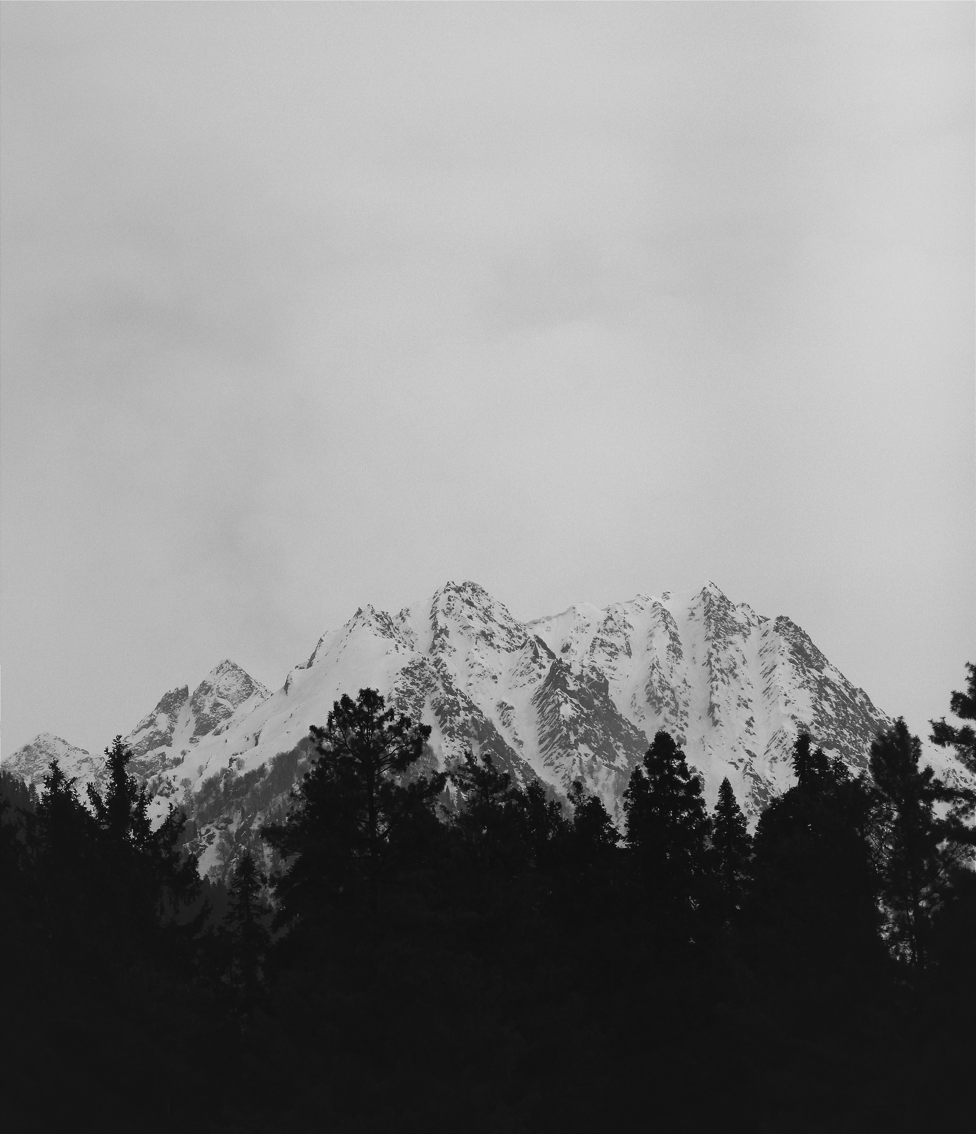 a black and white photo of a mountain range