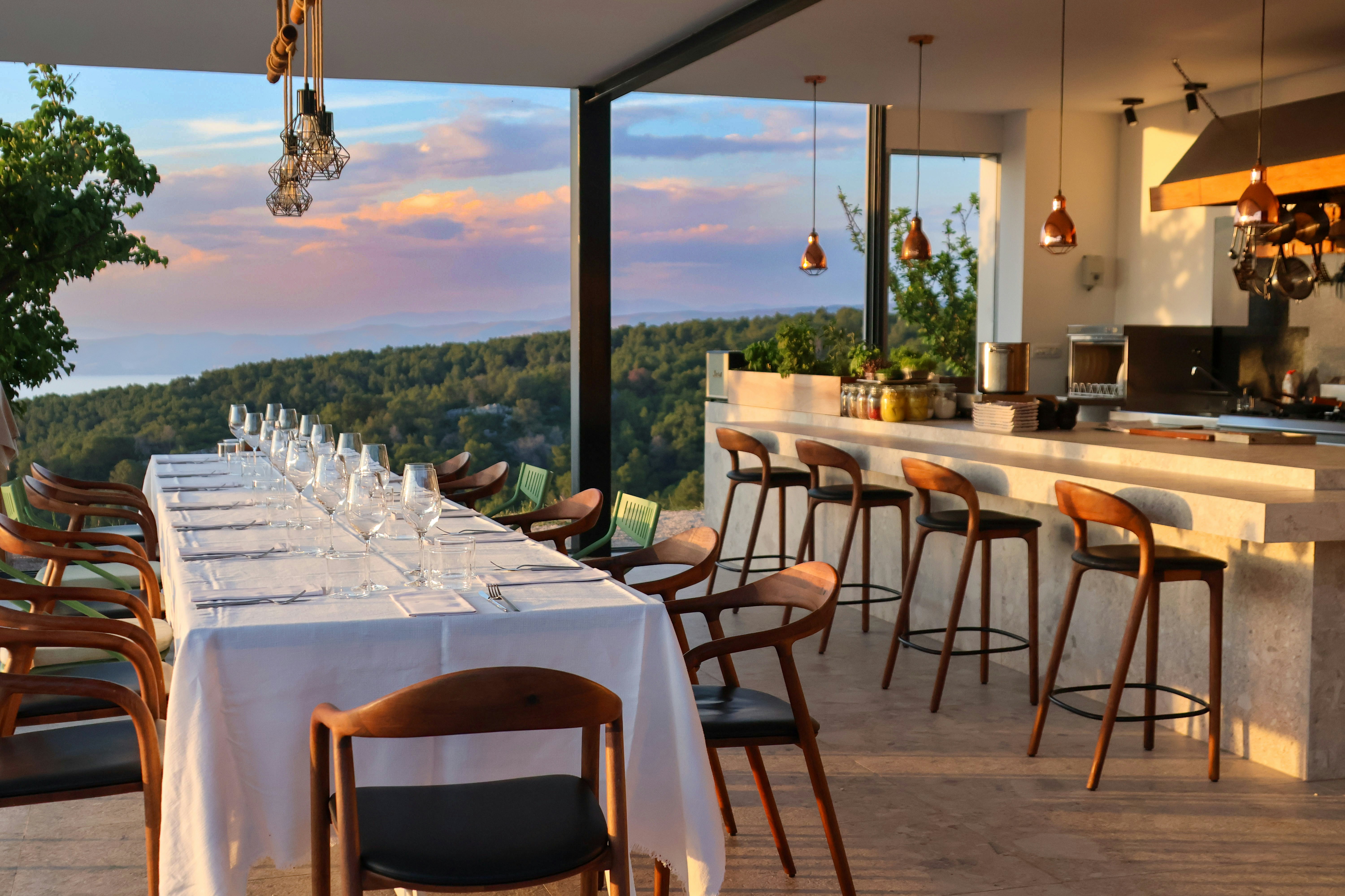 a dining room with a view of the mountains