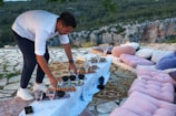 a man standing over a table filled with food