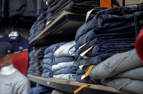 a rack of jeans in a clothing store