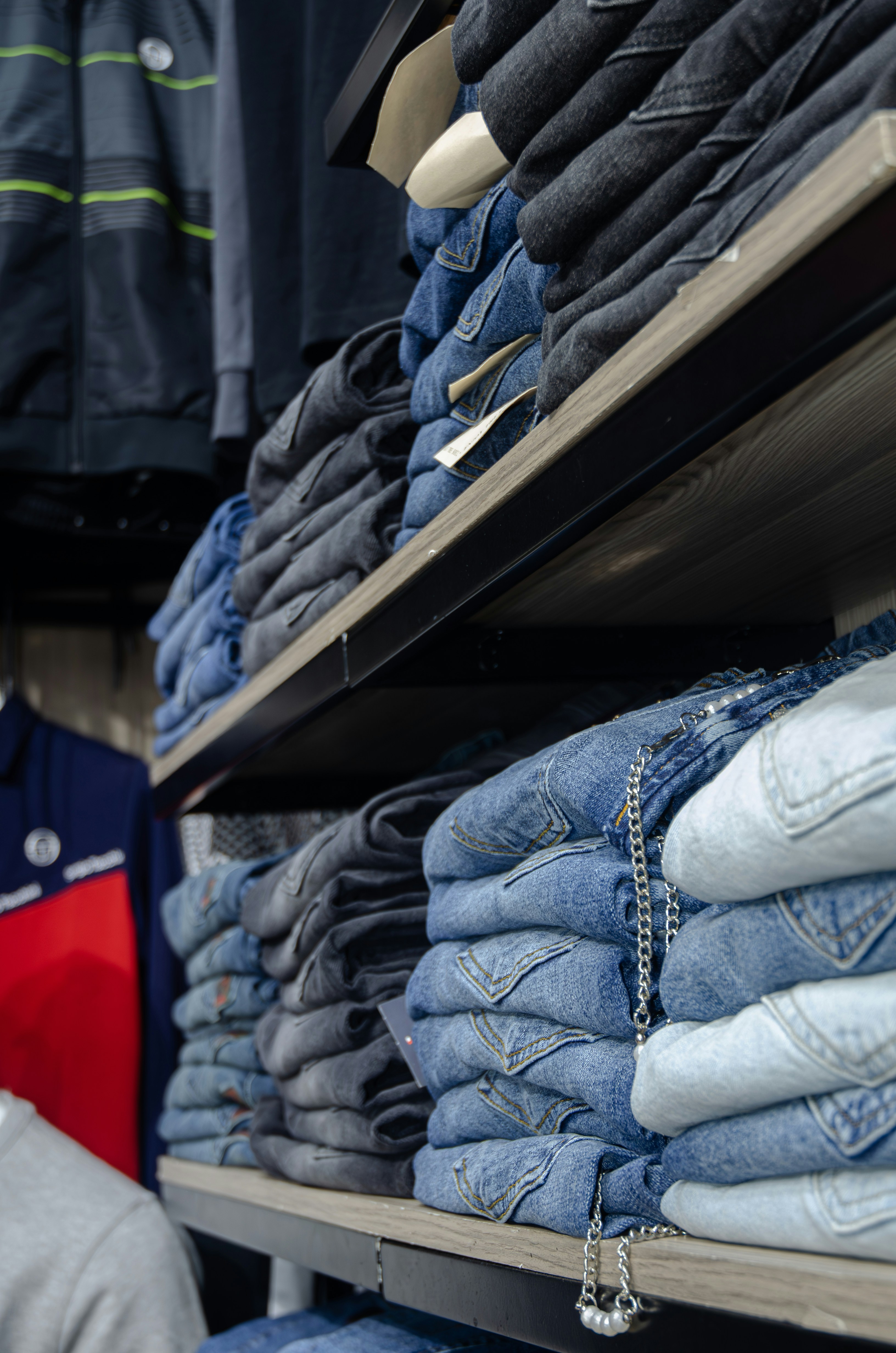 a store shelf filled with lots of blue jeans
