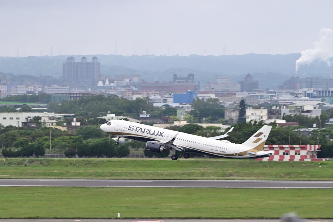 a large jetliner taking off from an airport runway,