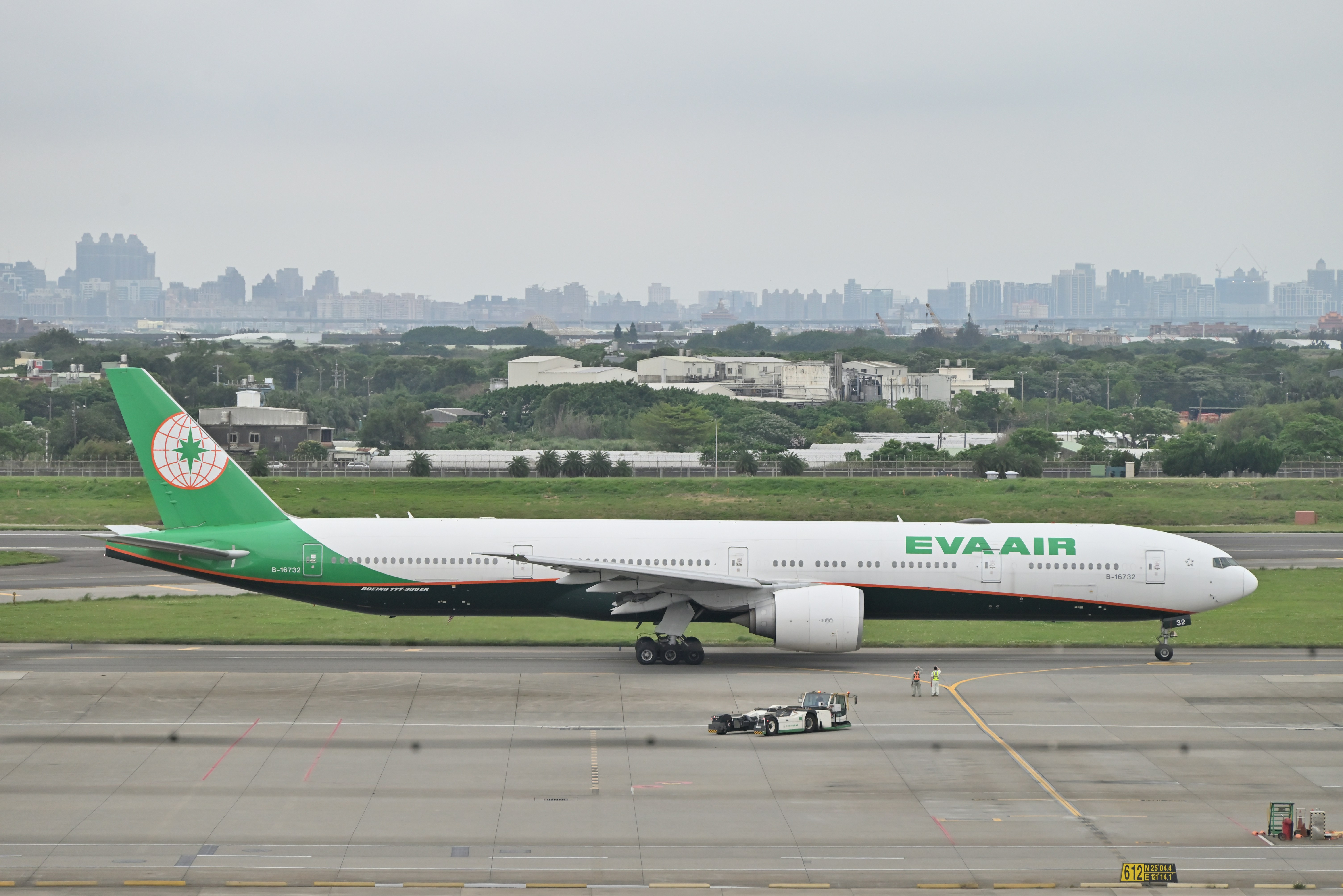 a large jetliner sitting on top of an airport tarmac, 