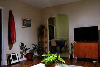 a living room filled with furniture and a flat screen tv