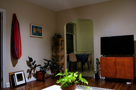 a living room filled with furniture and a flat screen tv