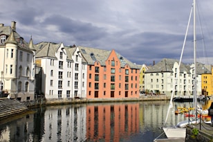 a row of buildings next to a body of water