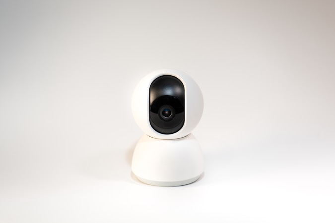 a white camera sitting on top of a white table