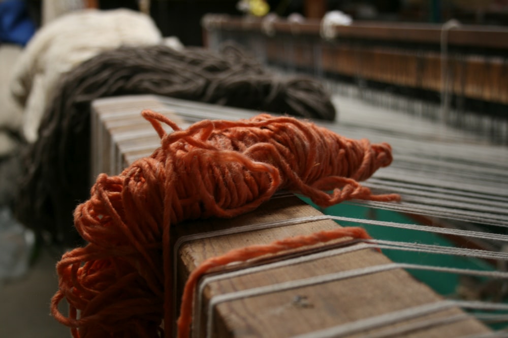 a close up of yarn on a conveyor belt