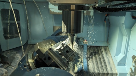 a machine that is cutting a piece of metal