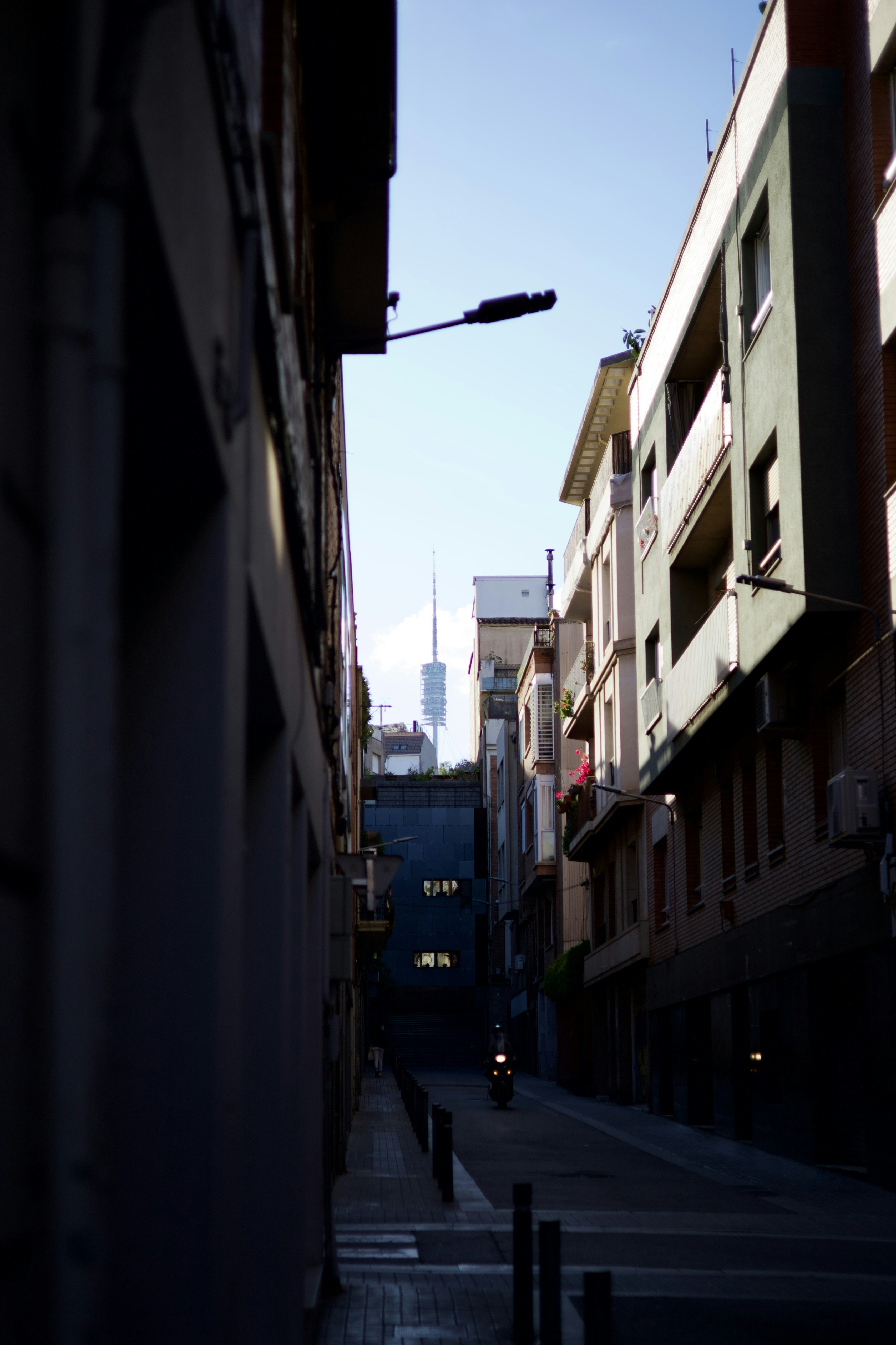 a city street with buildings and a traffic light