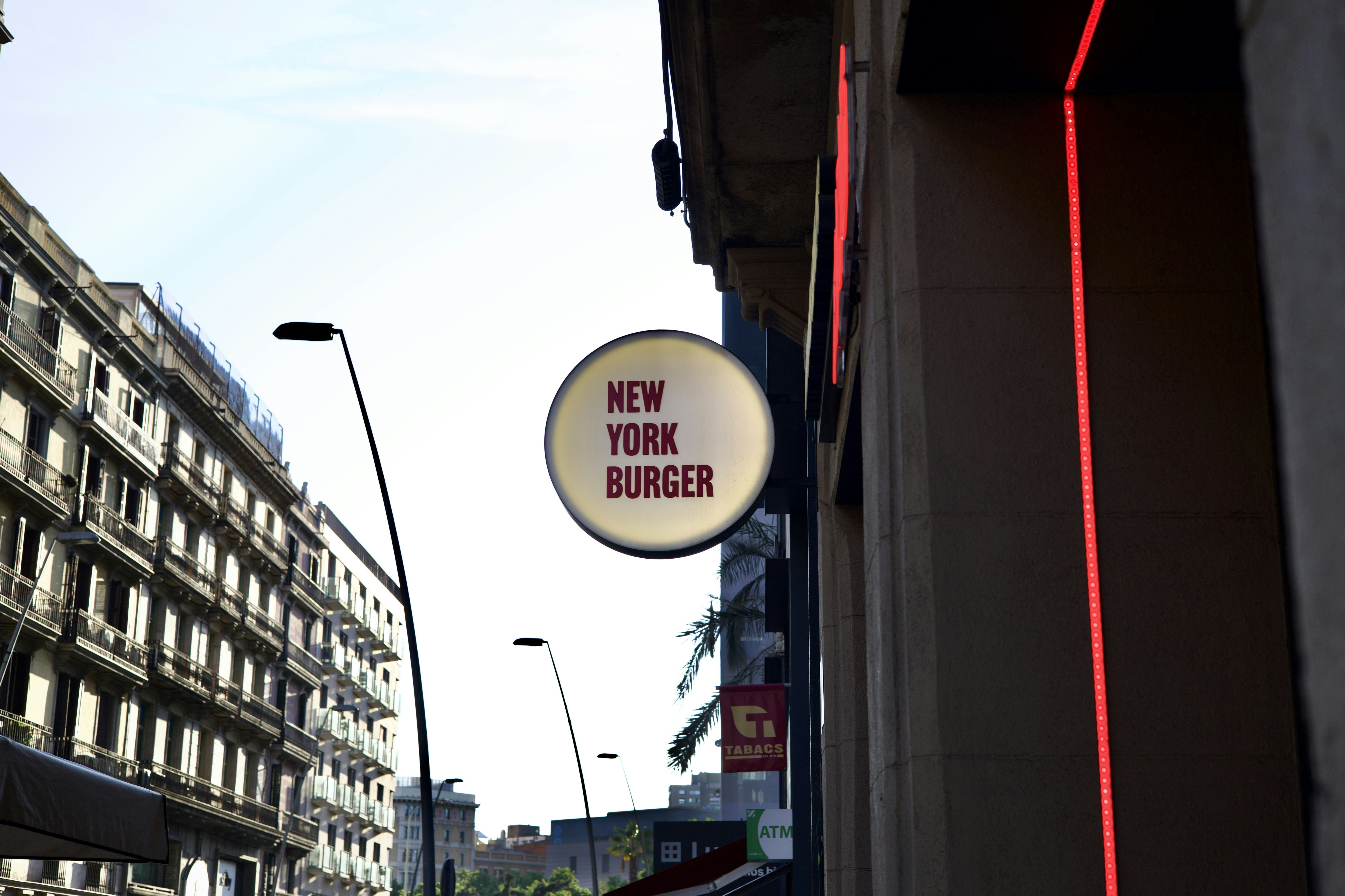 a sign on the side of a building that says new york burger