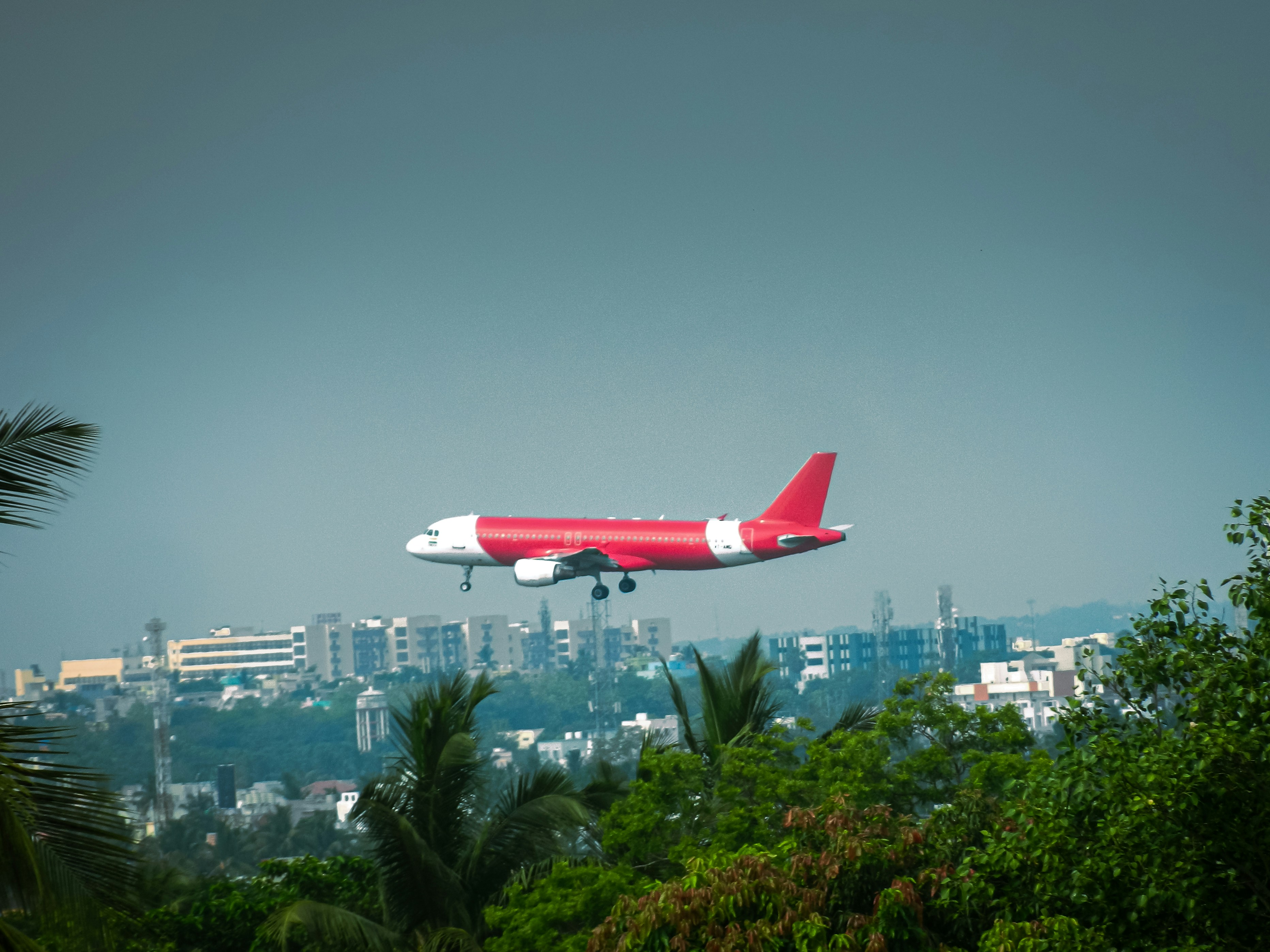 a large jetliner flying through a cloudy sky, ✈️✈️✈️