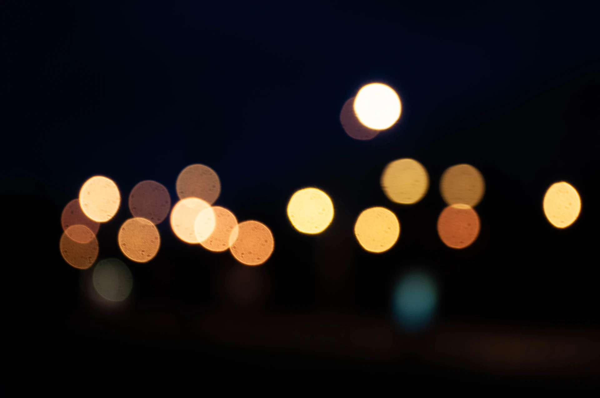 a blurry photo of a street at night