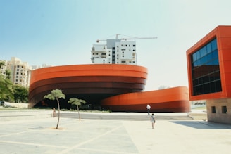 a person standing in front of a building under construction